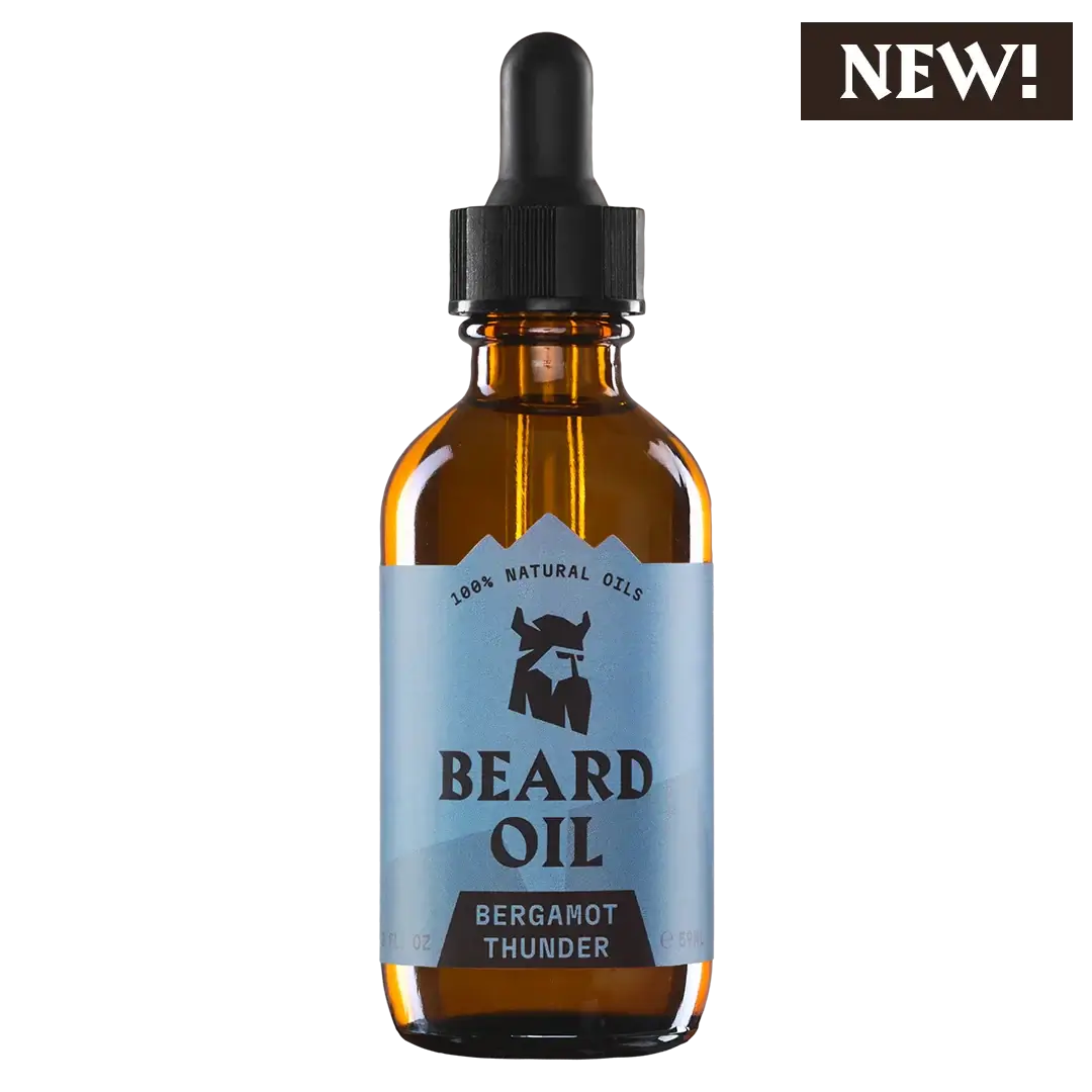 Bottle of beard oil with a dropper labeled 'Bergamot Thunder' on a white background.