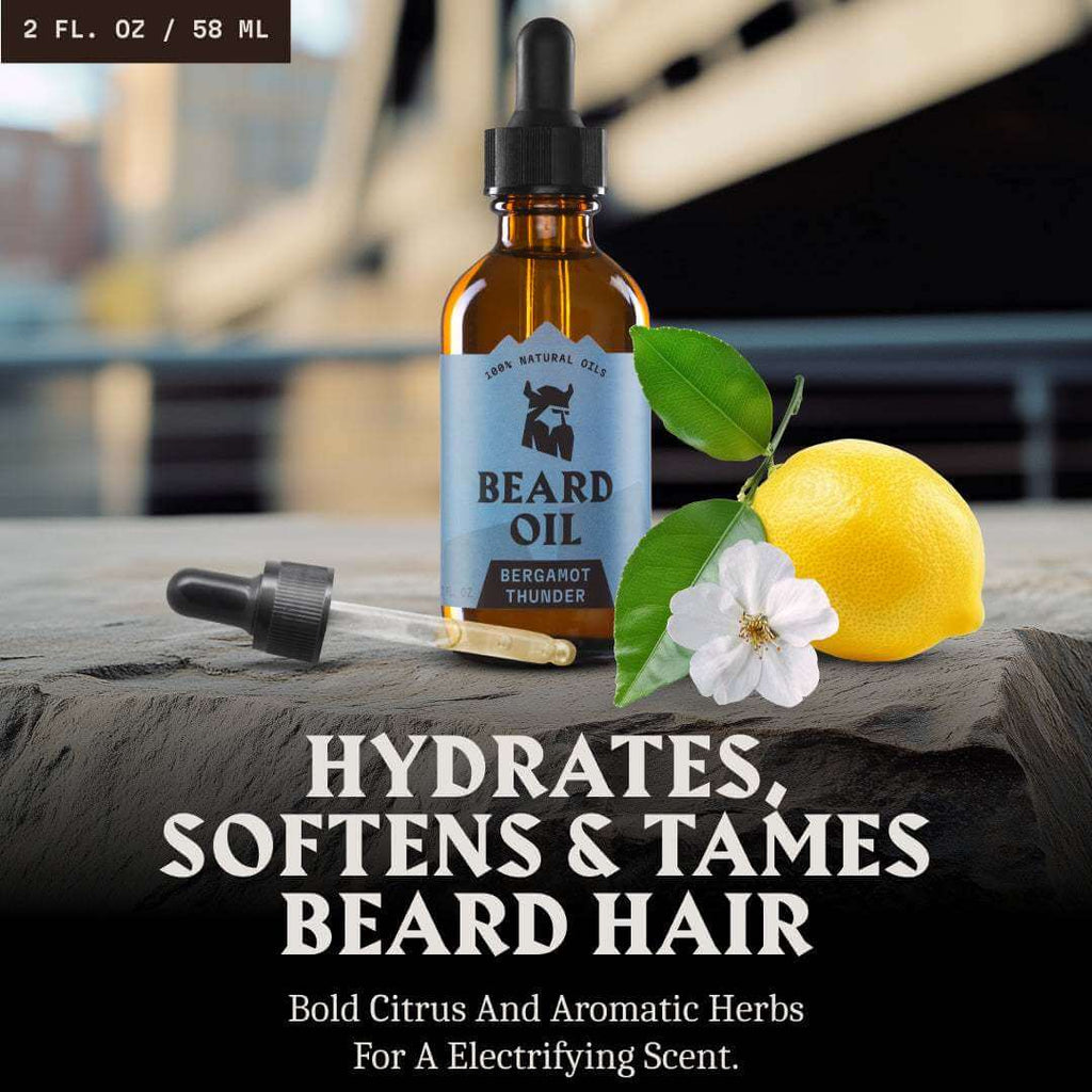 Beard oil bottle with lemon, flower, and dropper on a wooden surface with blurred background