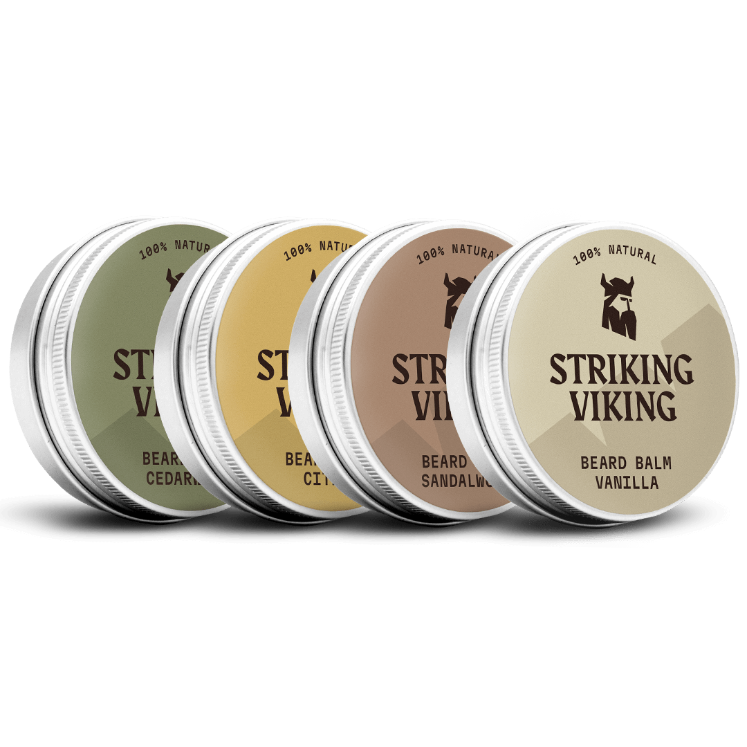 Four tins of Striking Viking beard balm on a white background