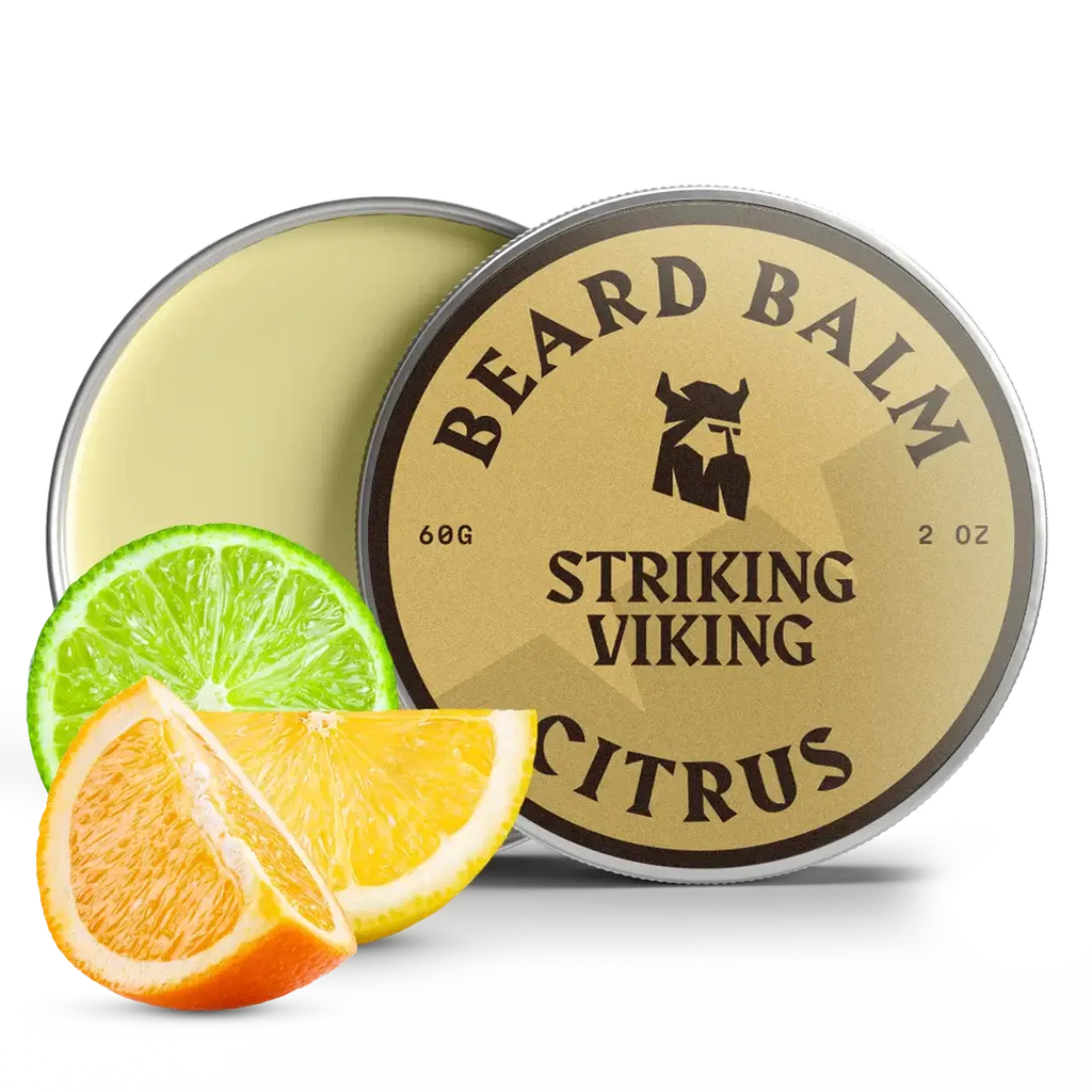 Beard balm container with 'Striking Viking' branding, accompanied by citrus slices on a white background.
