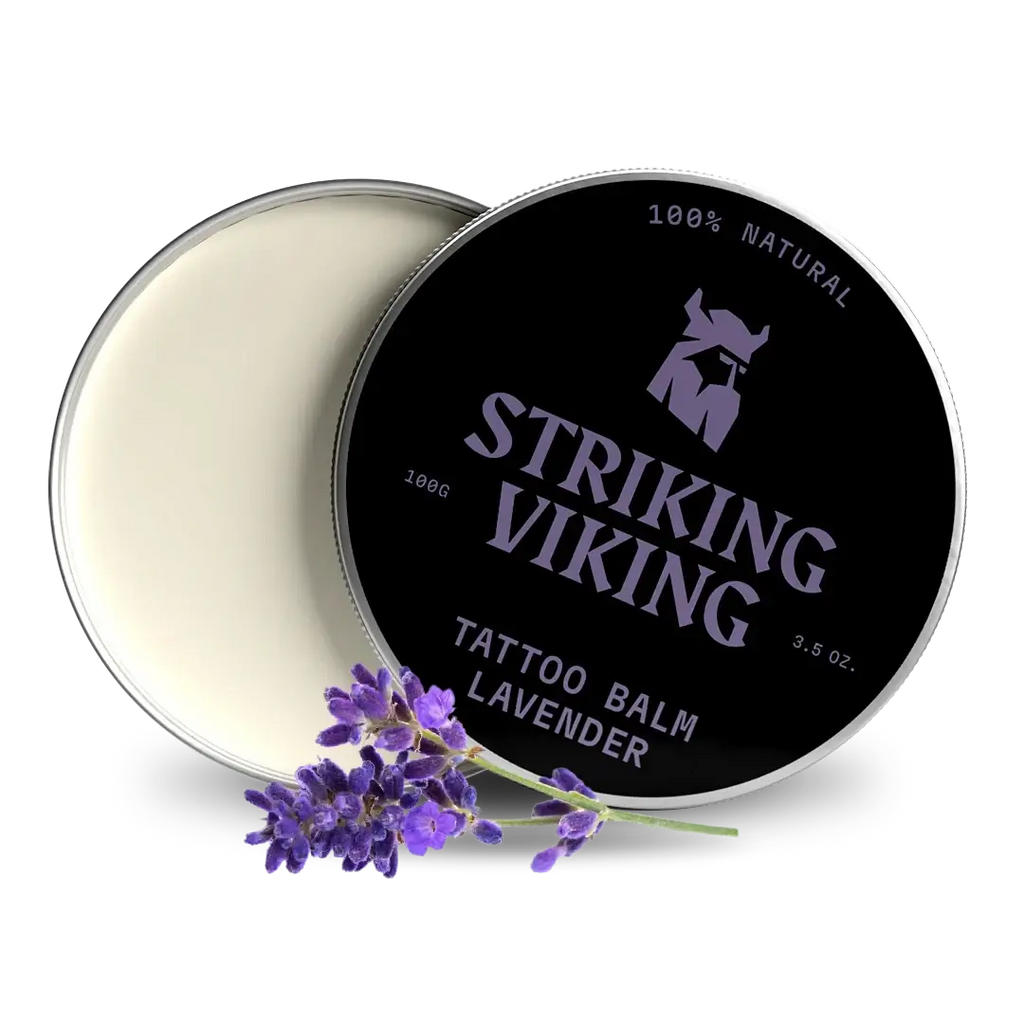 Striking Viking tattoo balm container with lavender flowers on a white background