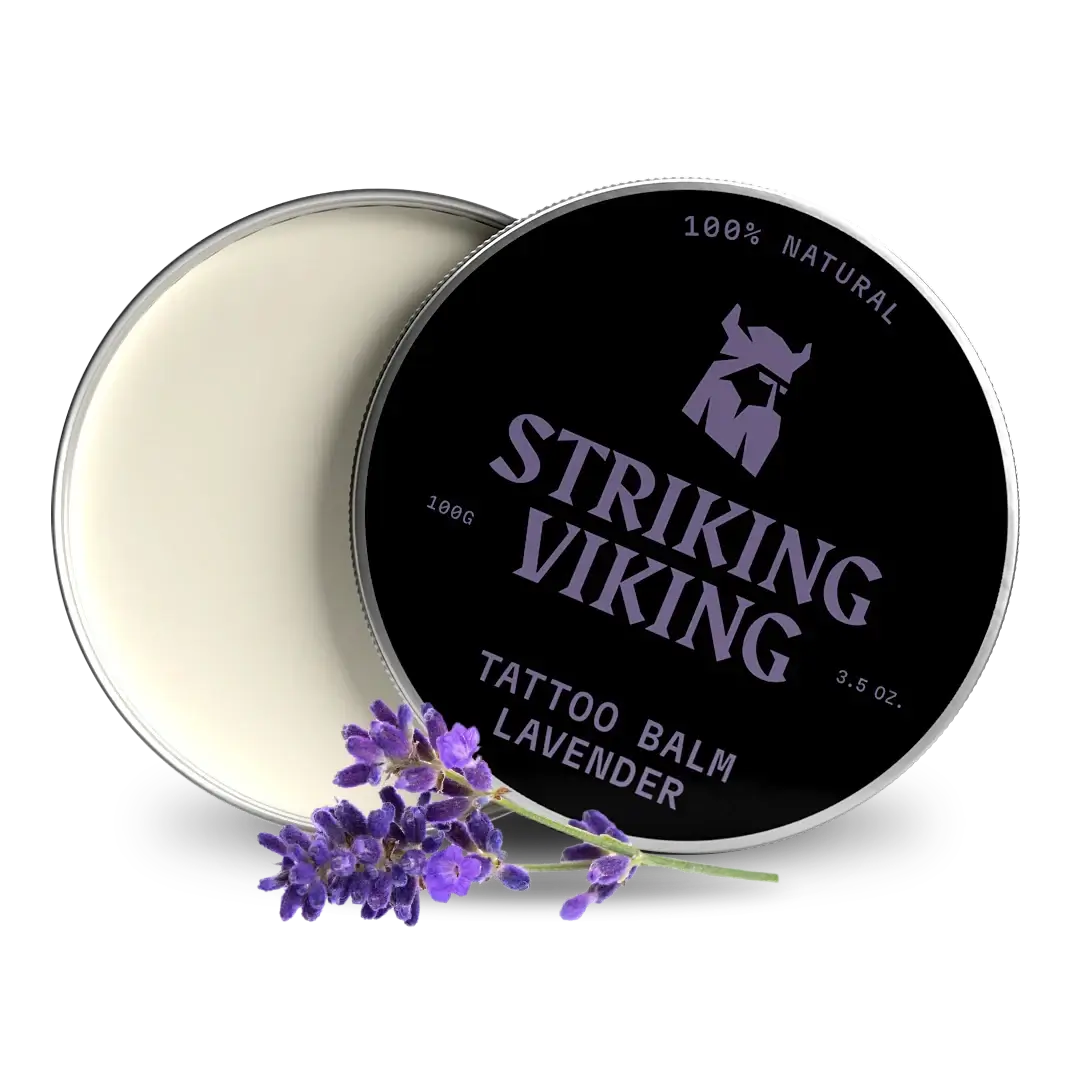 Striking Viking tattoo balm container with lavender flowers on a white background