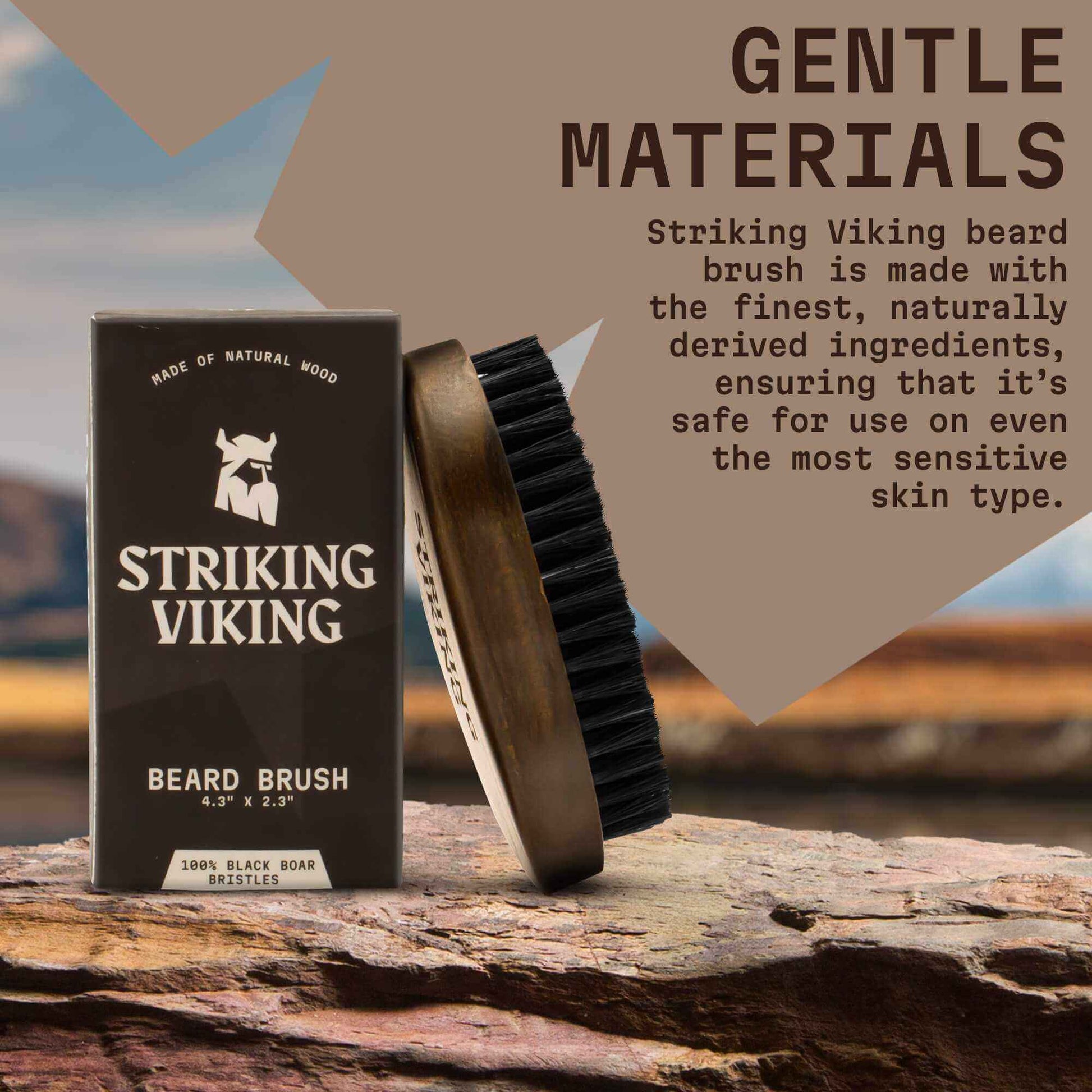 Striking Viking beard brush with packaging on a wooden surface, featuring text about gentle materials.