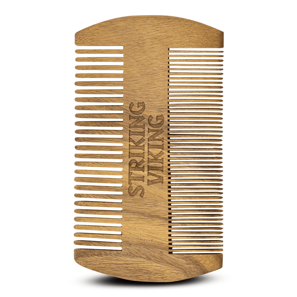 Wooden comb with 'Striking Viking' engraving on a white background